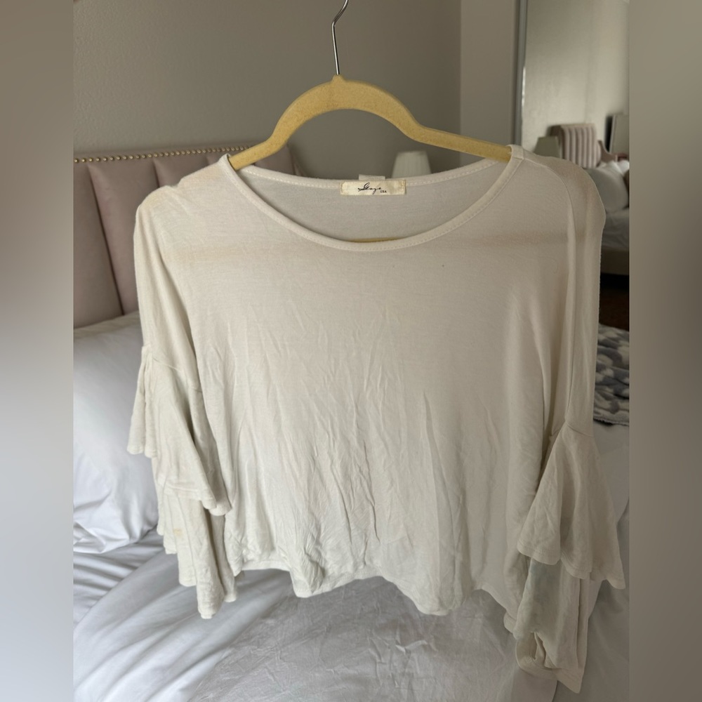 Ruffled white blouse